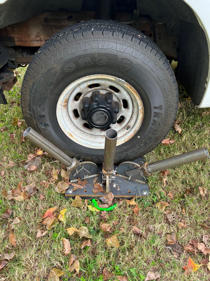 the base of the camouflage device sits under the vehicle tire