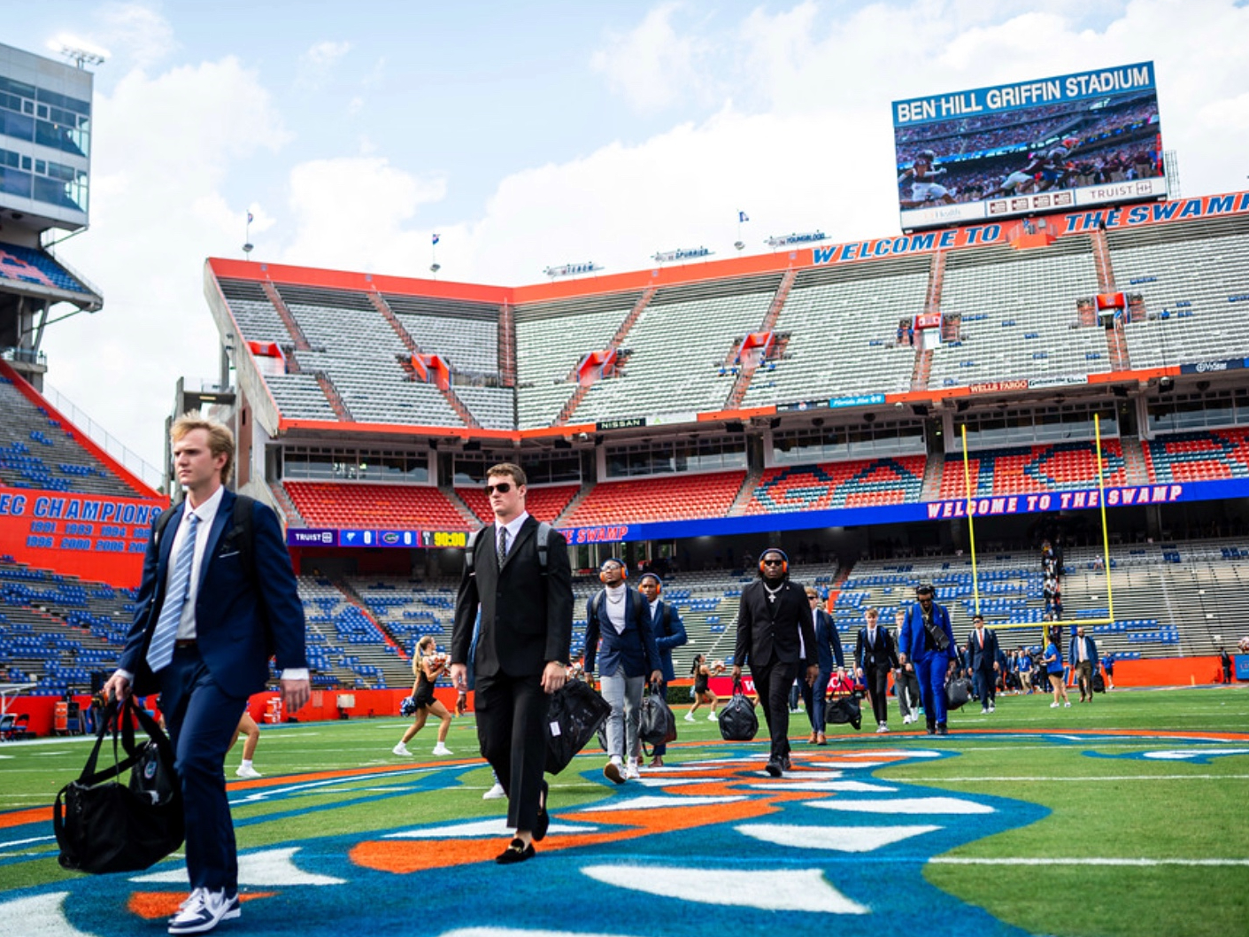 UF football players walking on the field