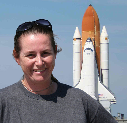 Astrobiologist Jamie Foster and Kennedy Space Center with the space shuttle in the background