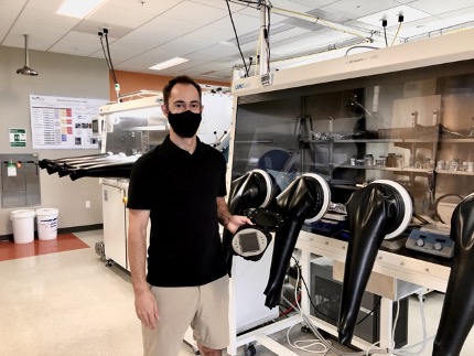 Mattrix CEO and founder, Max Lemaitre, displays new, full-color OLED display prototype in one of the Mattrix Technologies labs located in The Hub.