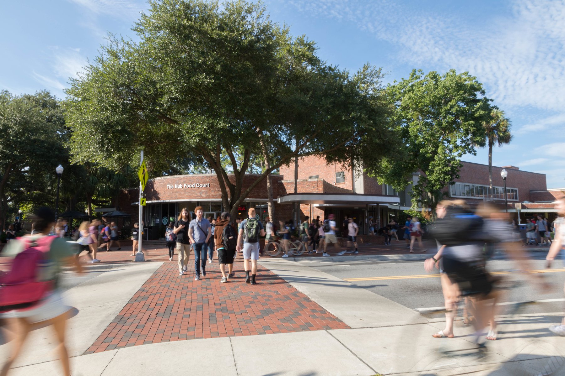 Students crossing a street on campus