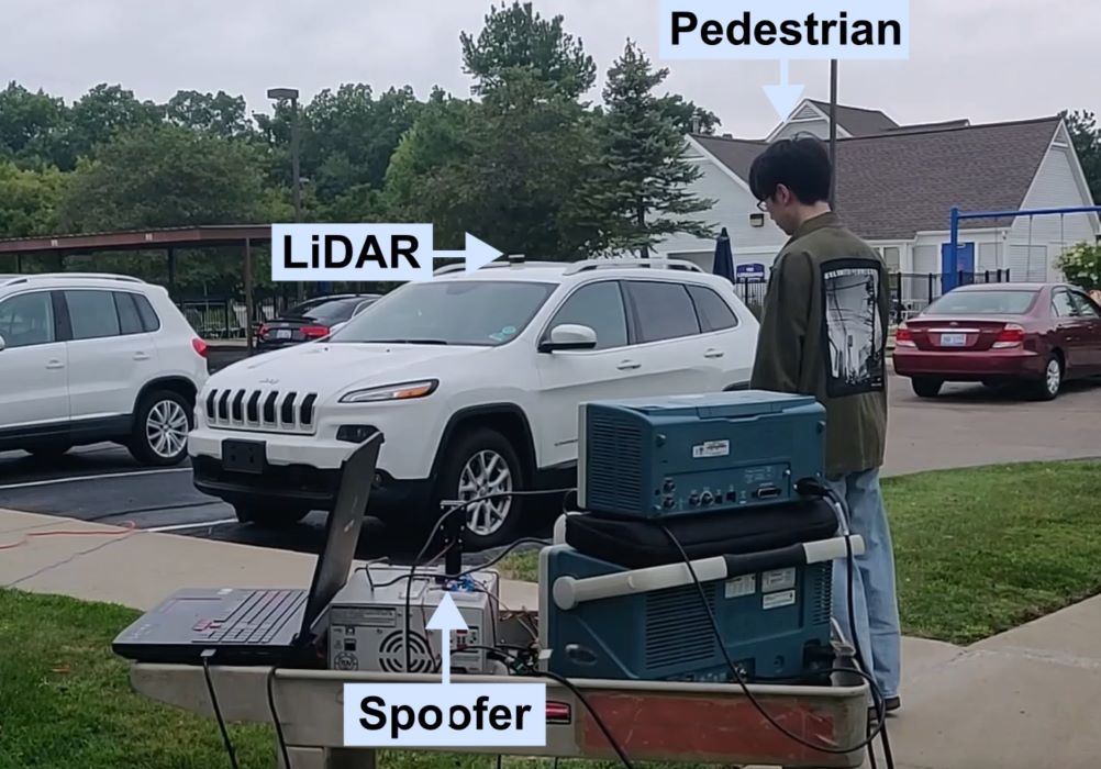 A pedestrian standing near an autonomous vehicle with a laser device in the foreground