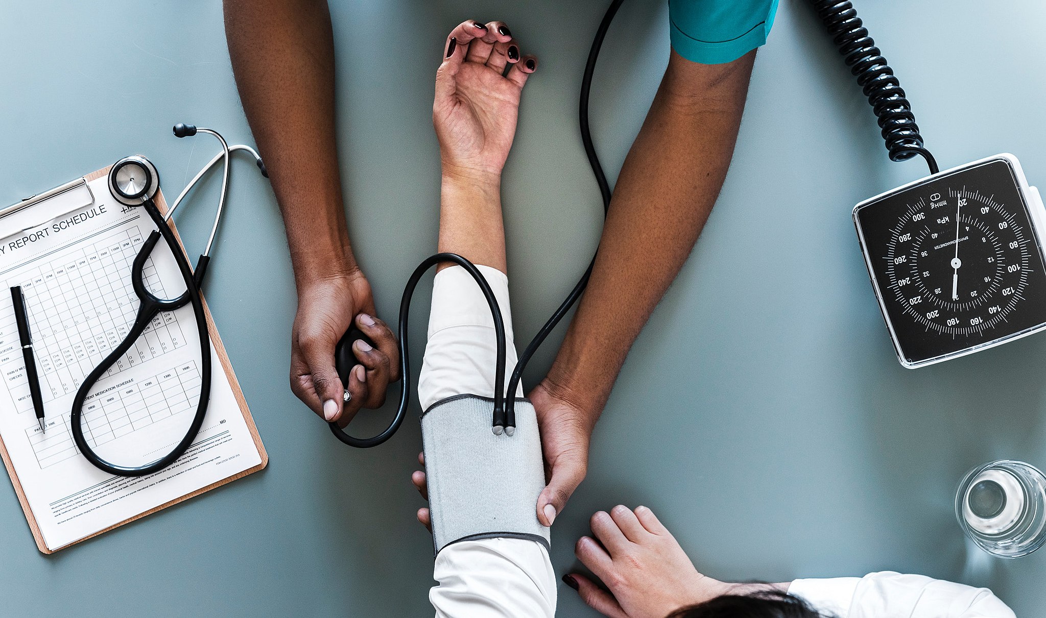 A medical professional measuring a patient's blood pressure