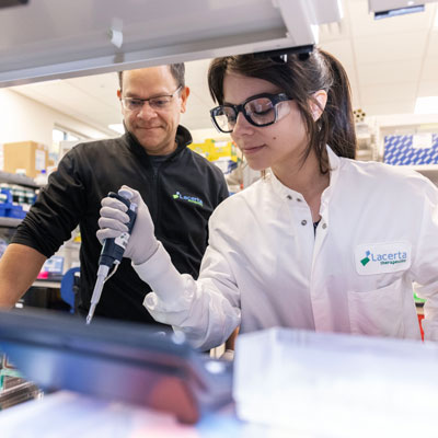 A professor and a student working in a lab.