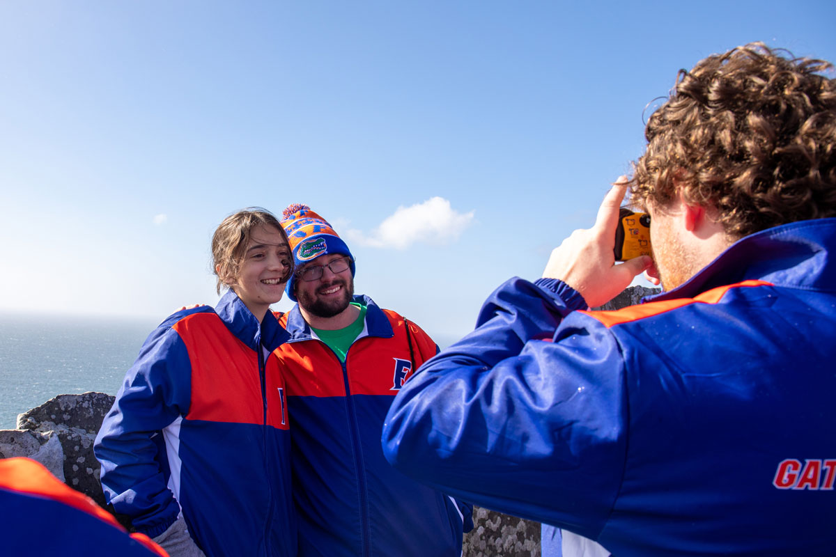 Students pose for a photo at the Cliffs of Moher
