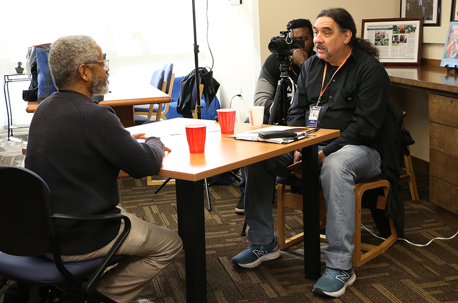 Anthony Cohen, left, a descendent of freedom seeker Patrick Sneed, recounts a family history to Paul Ortiz, director of the Samuel Proctor Oral History Program at UF