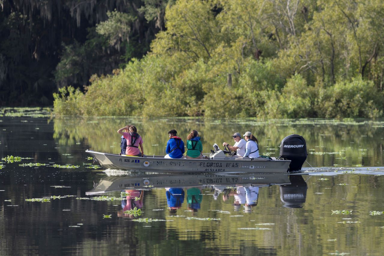 People in a small boat on a Florida lake