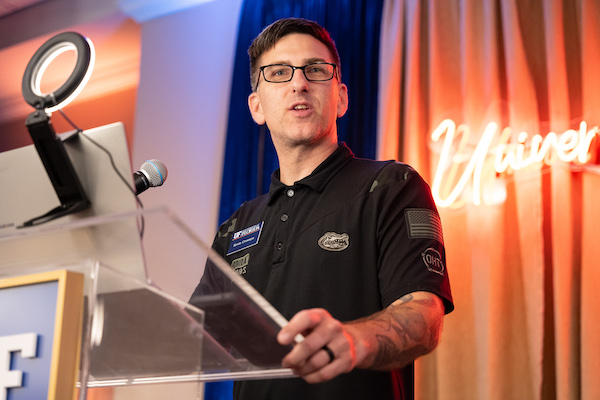 Army veteran Kevin Doe Crowsyn talks to members of the military.