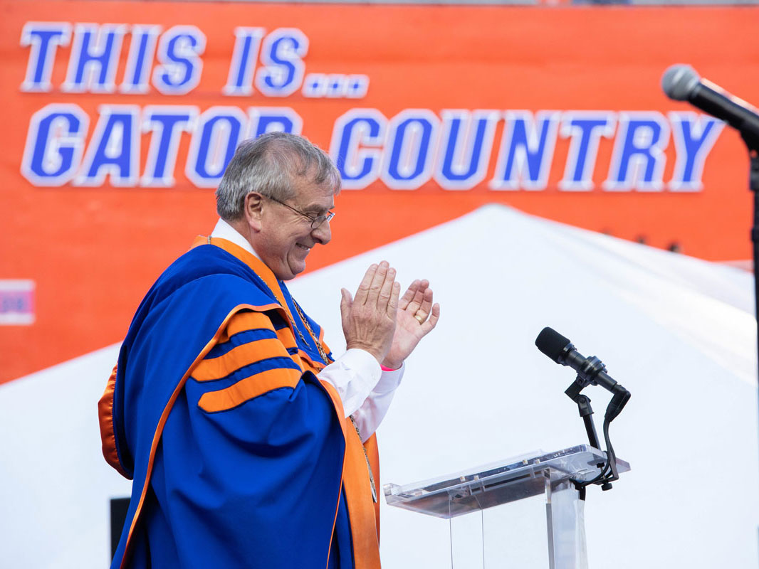 UF Interim President Kent Fuchs speaking at graduation in the stadium.