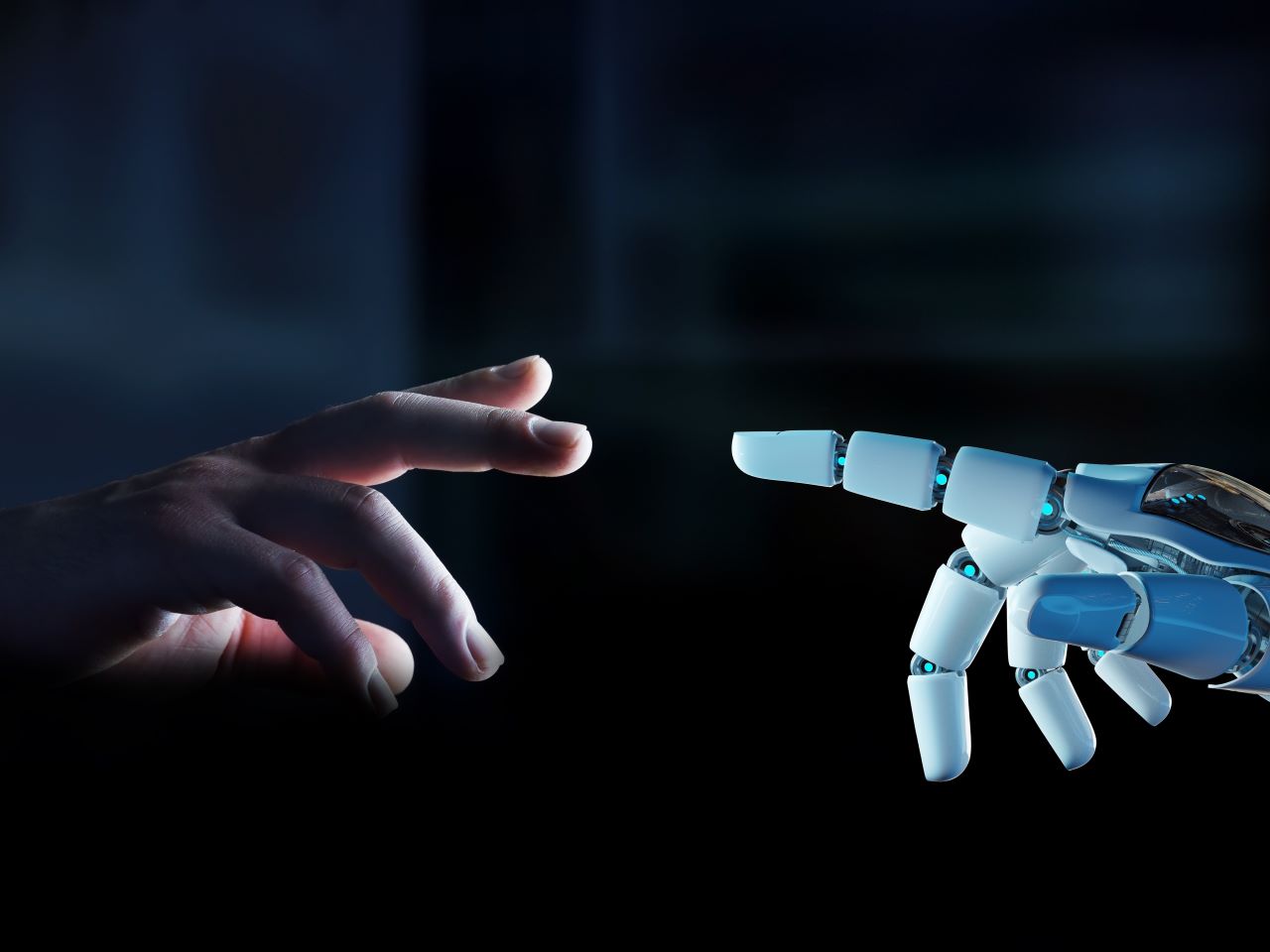 A human hand reached toward a robot hand against a dark background