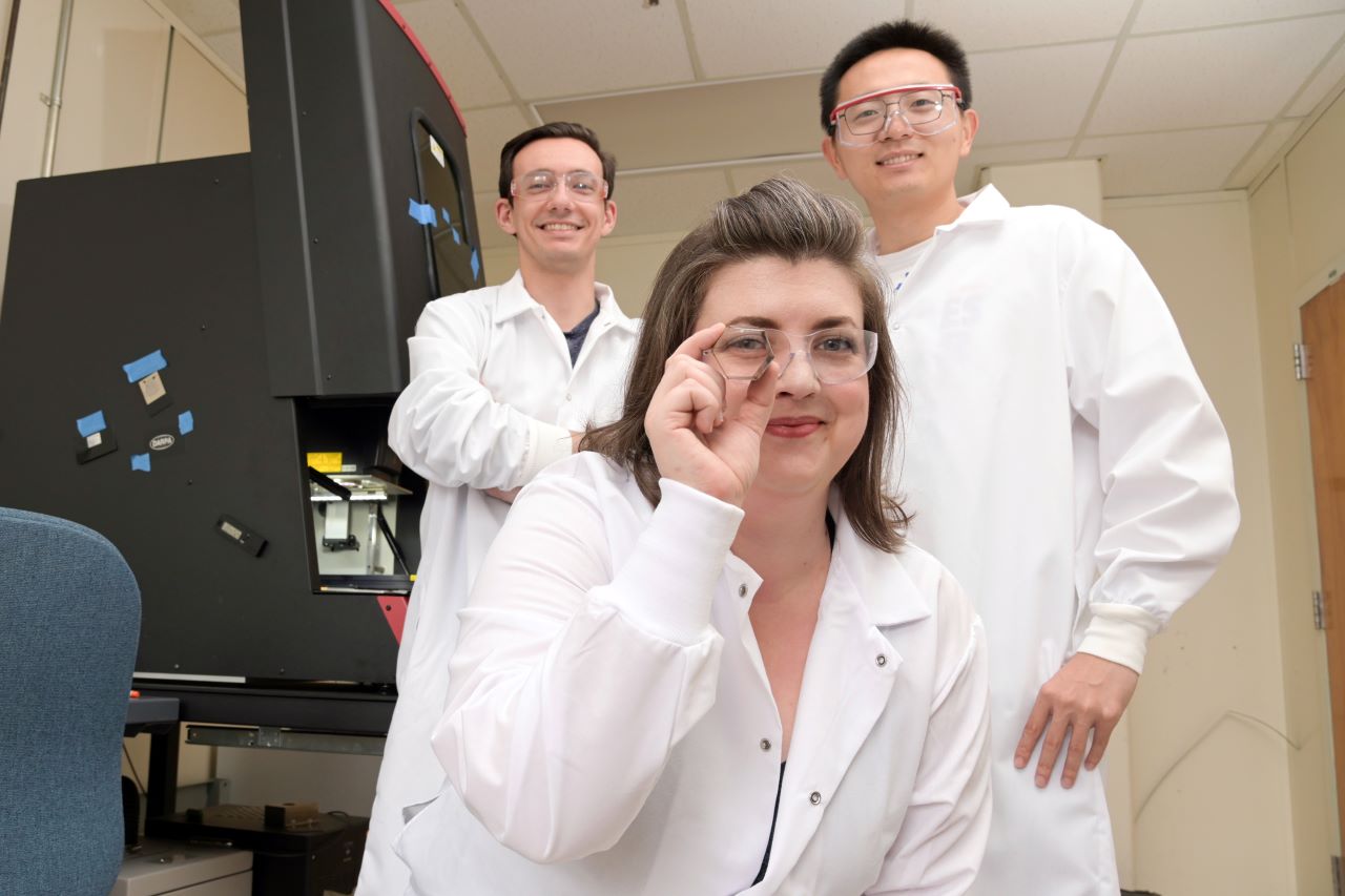 Victoria Miller and two PhD students behind her