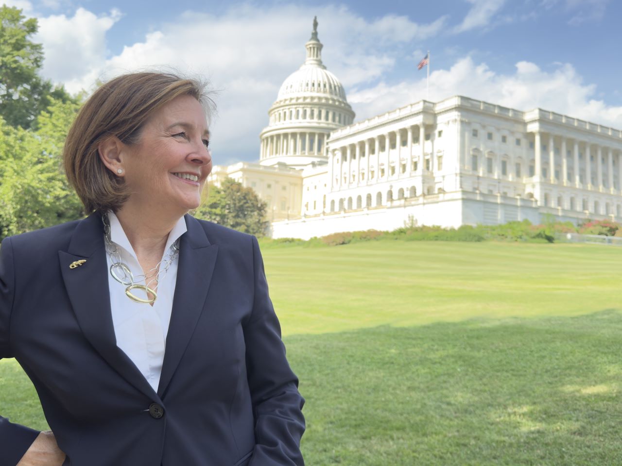 Sarah Mathias standing with the US capitol in the background