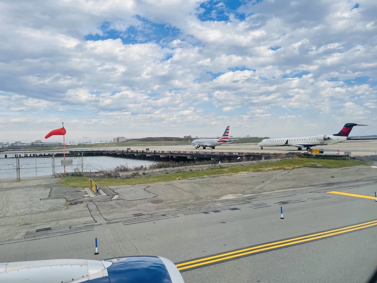 Planes waiting on a runway.